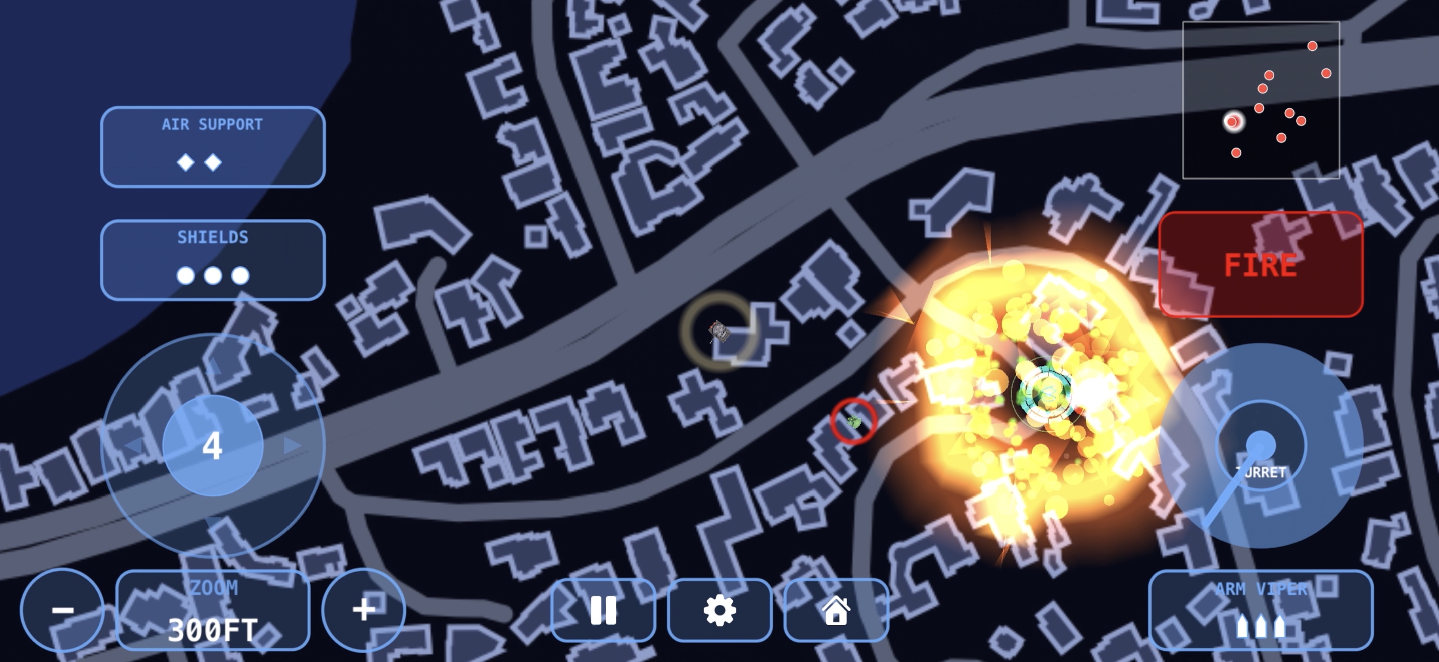 An airstrike detonating on an alien position, with the FIRE button and minimap visible